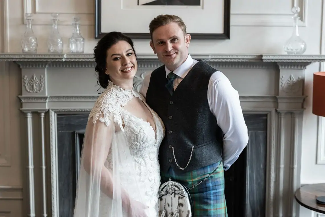 Bride and Groom portrait in front of fire place
