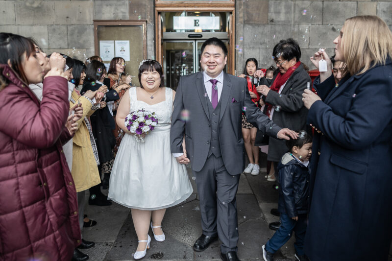 Chowping and David walk through a 'bubble tunnel' as they exit City Chambers Marriage Suite