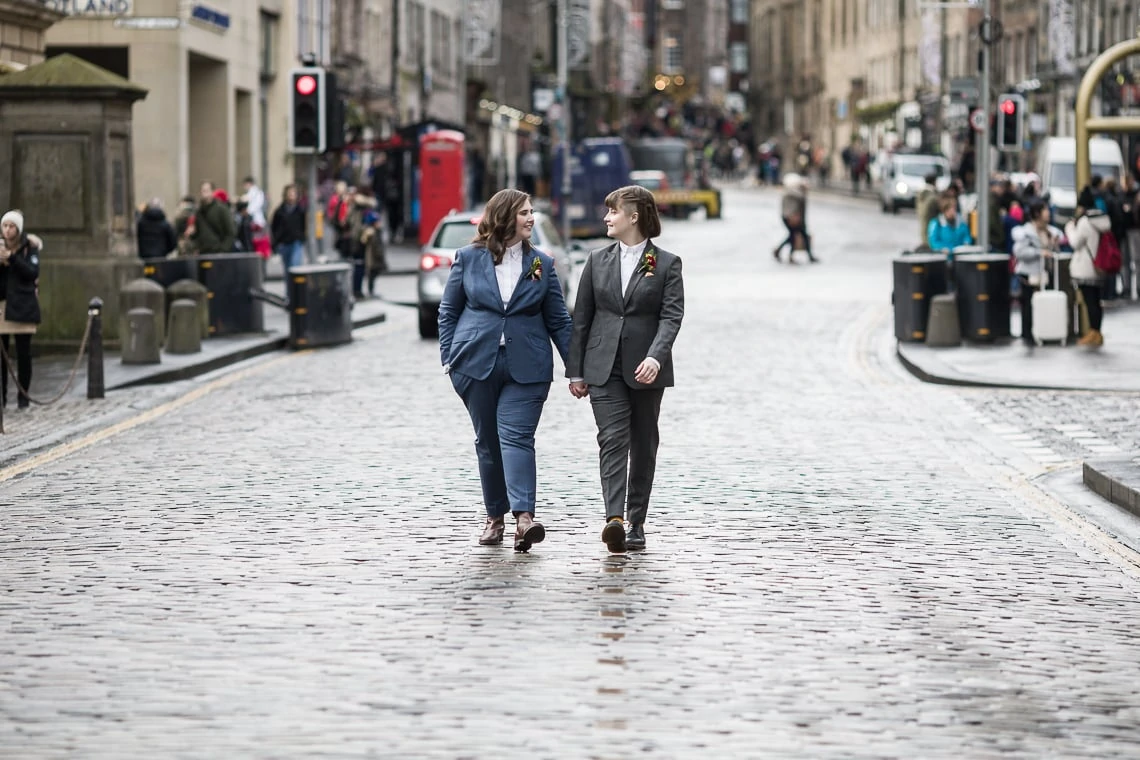 newly-weds walking on Royal Mile