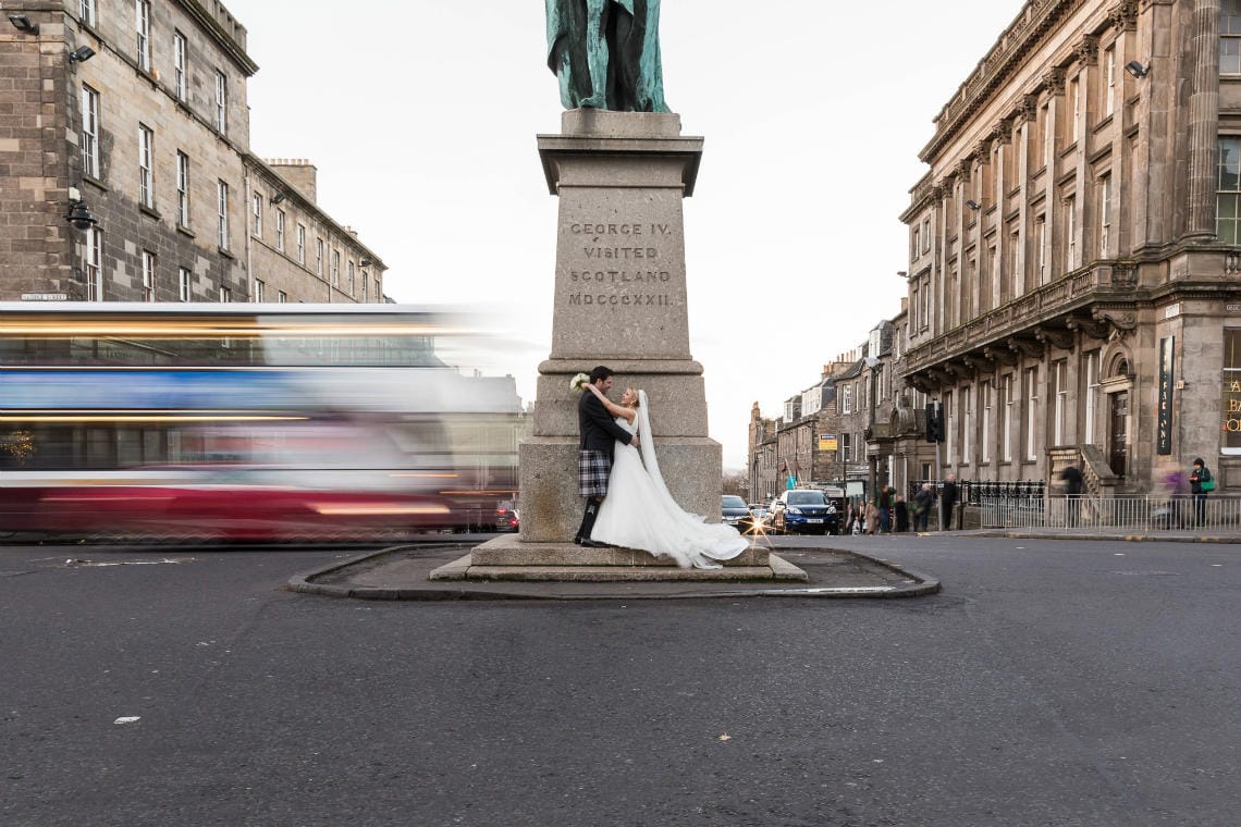 Edinburgh George Hotel Wedding newly-weds slow shutter photo on George Street Edinburgh