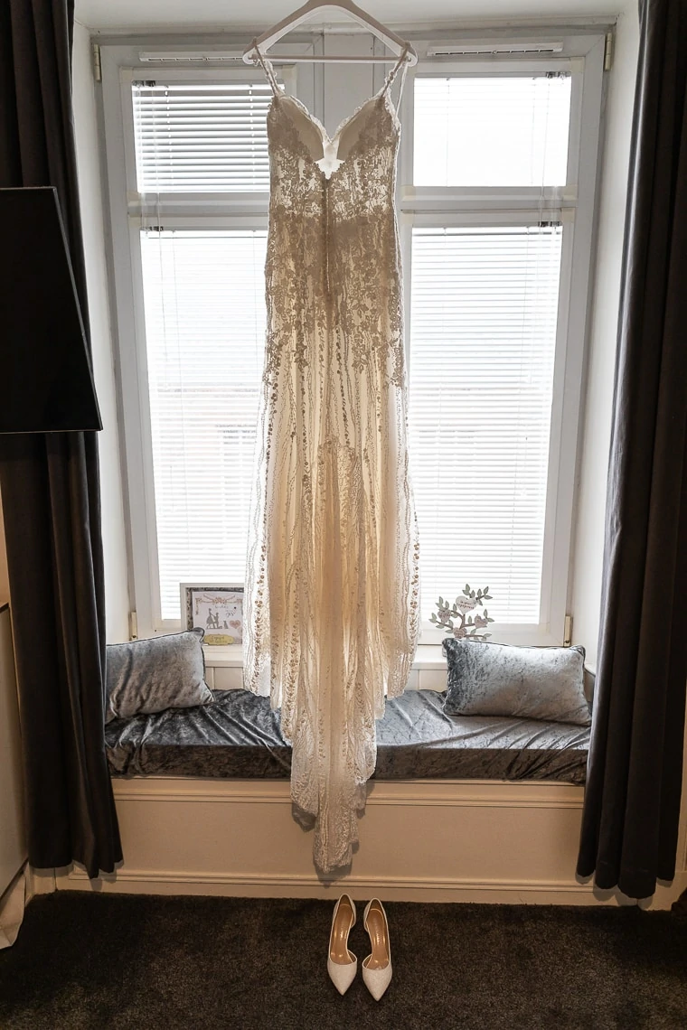 Rosa Clara wedding dress hanging in window