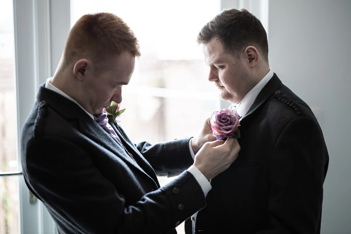 groomsman and Best Man fitting buttonhole by Annie Thompson Flowers