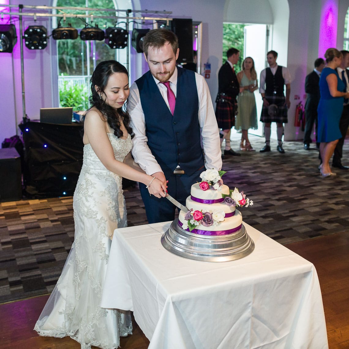 Eskmills Venue Wedding newlyweds cutting wedding cake