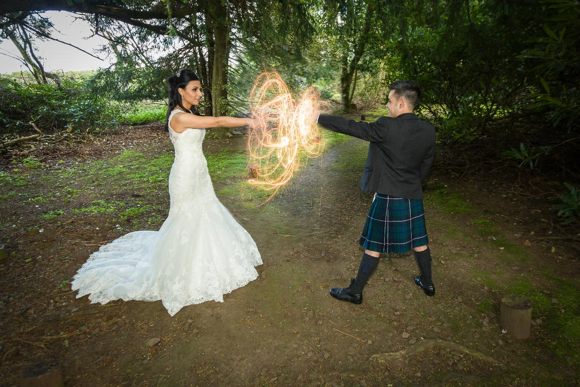 Garden - newlyweds slow shutter sparklers