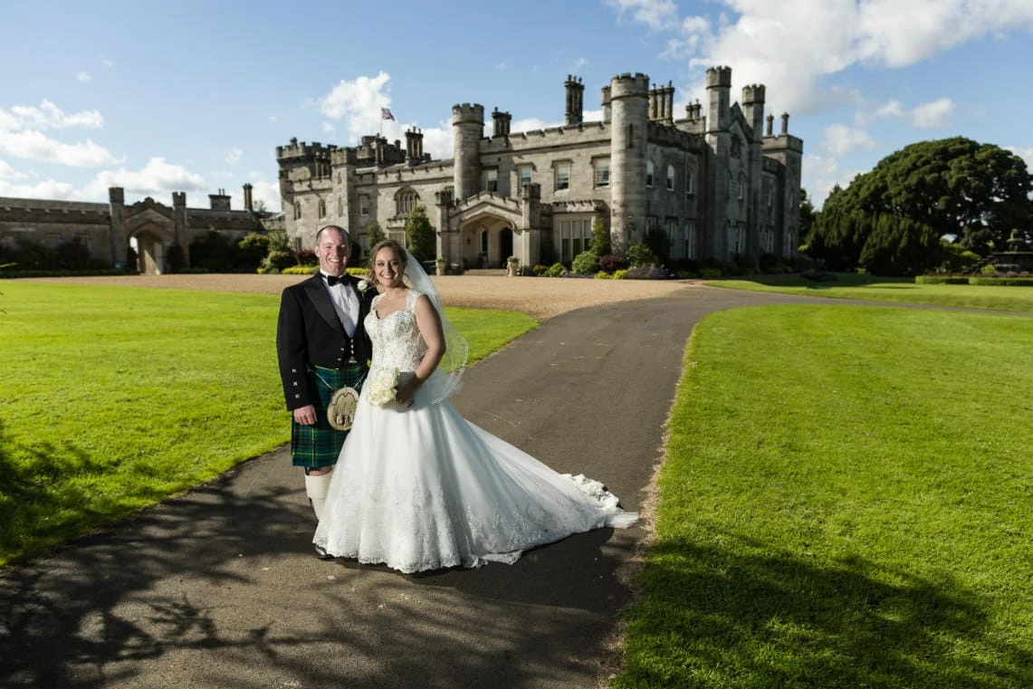 Gardens newlyweds with Dundas Castle in the background