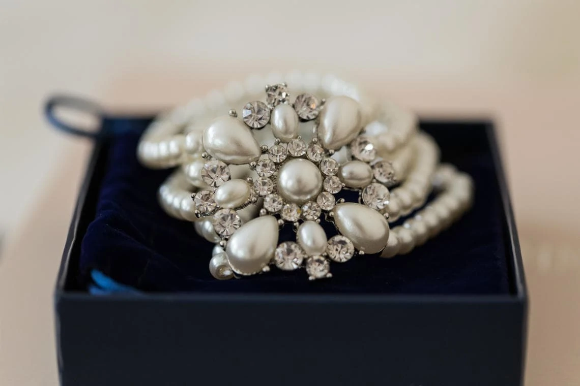 bride's diamante and pearl hair decoration sat in a blue box