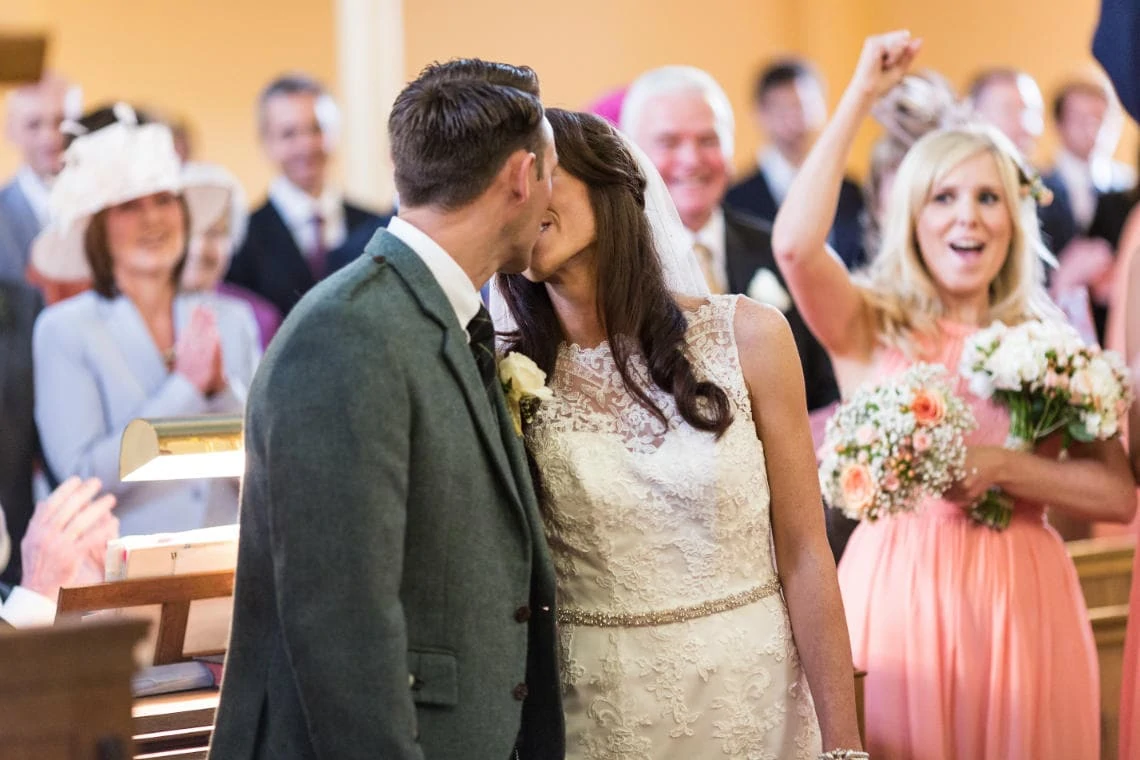 newlyweds' first kiss at the Church