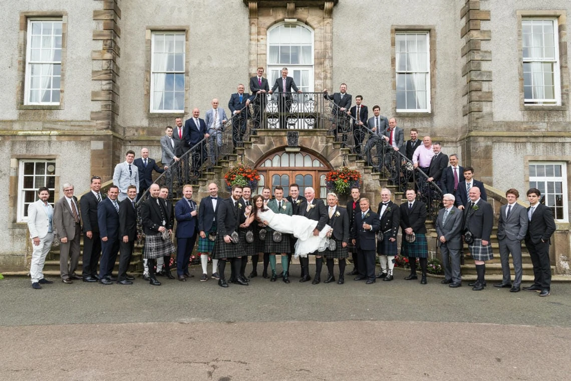 Golf course and grounds - group photo bride and all the guys on the staircase