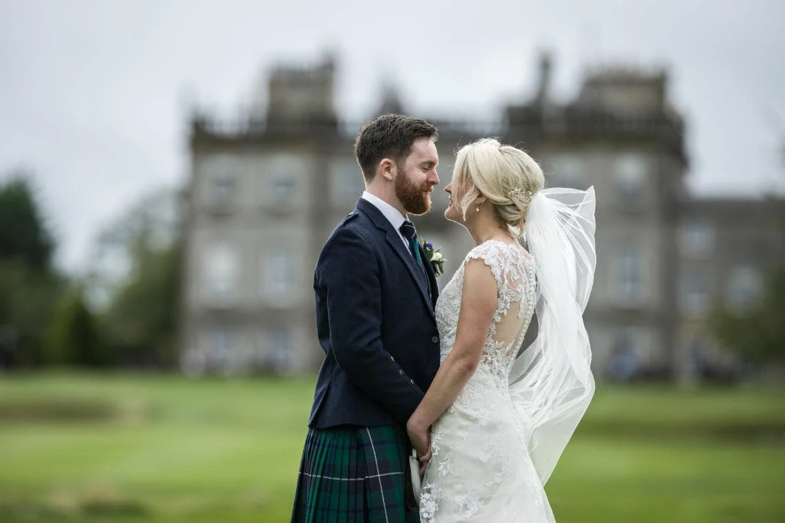 Golf course and grounds - newlyweds looking at each other