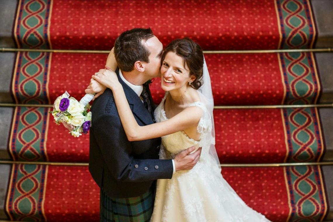 Grand Staircase newlyweds embrace