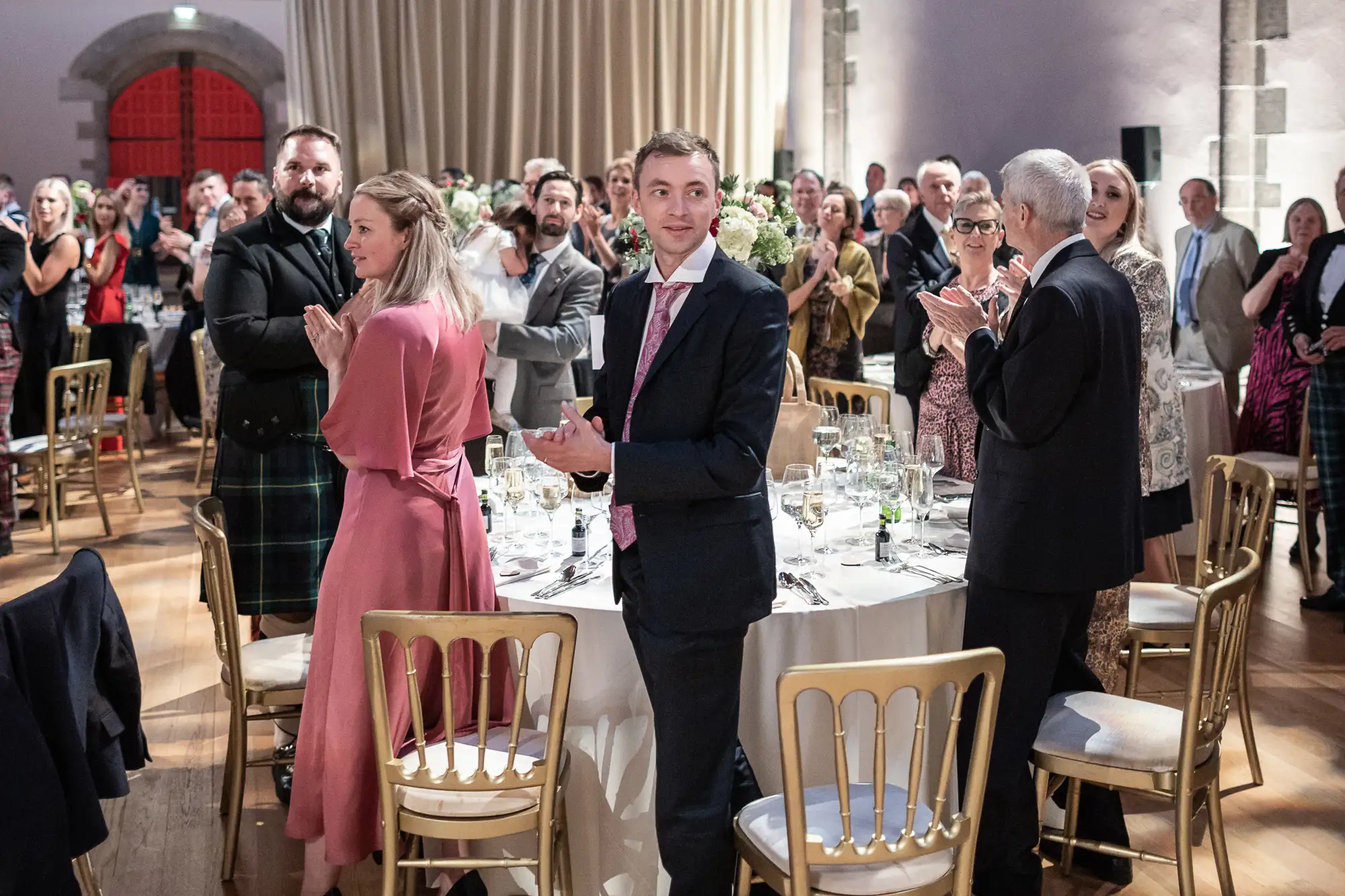 guests standing clapping during speeches