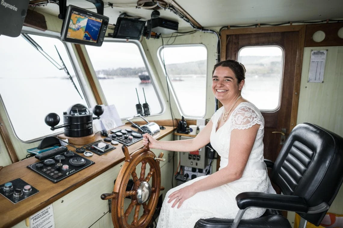 Bride-to-be sits in the Captain's chair of The Maid Of The Forth