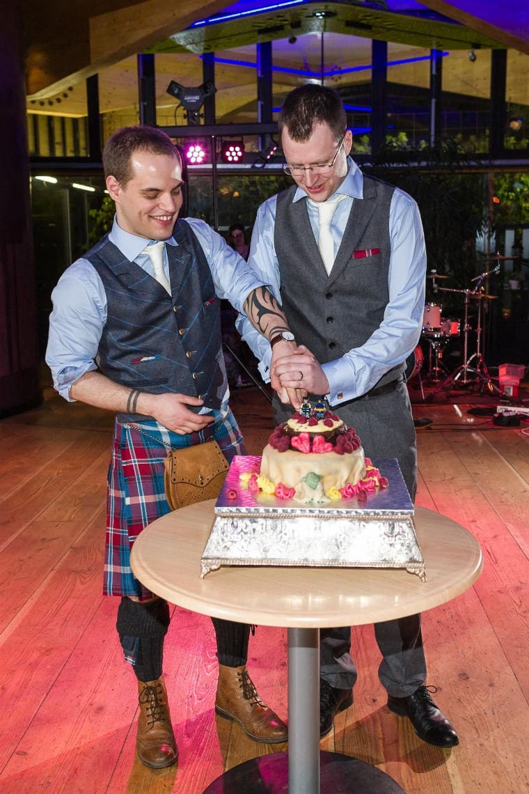 John Hope Gateway evening reception same-sex newlyweds cut the cake