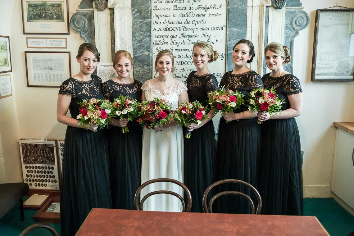 bride and bridesmaids group photo in the vestry