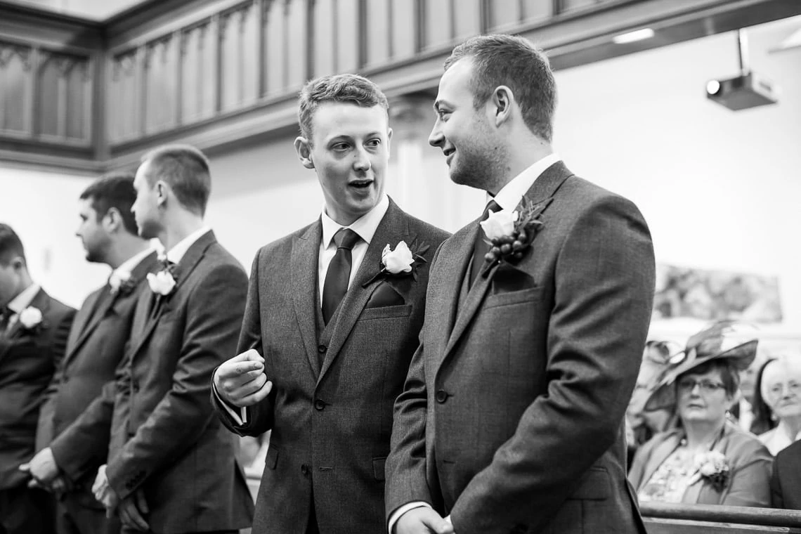best man chatting with groom before the ceremony begins