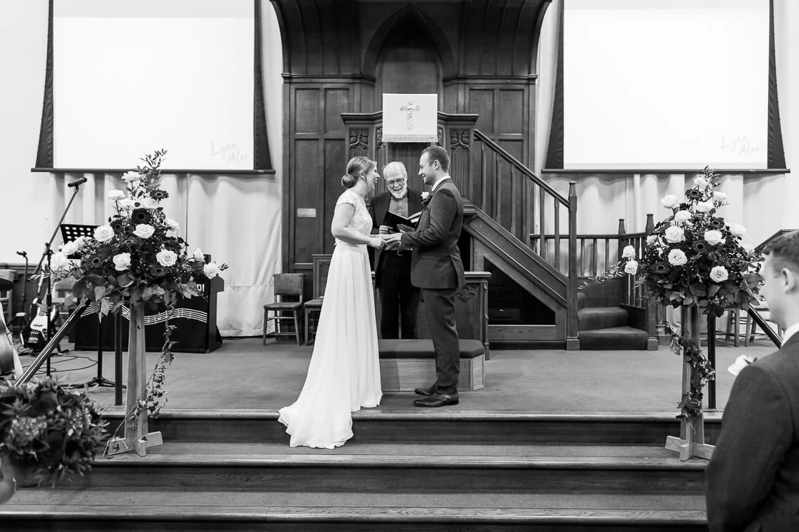 exchange of rings during ceremony at Liberton Kirk