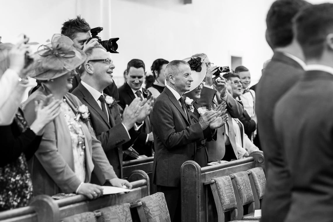 guests applaud the newlyweds at Liberton Kirk