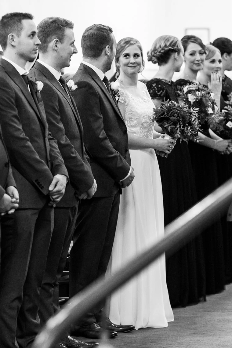bride smiles at the groom at Liberton Kirk