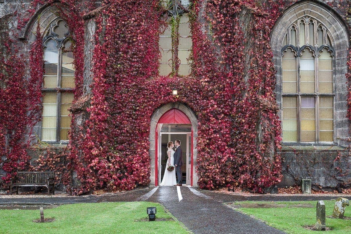 Liberton Kirk And Edinburgh George Hotel Wedding Photos - Lynn and Alex at the door of Liberton Kirk