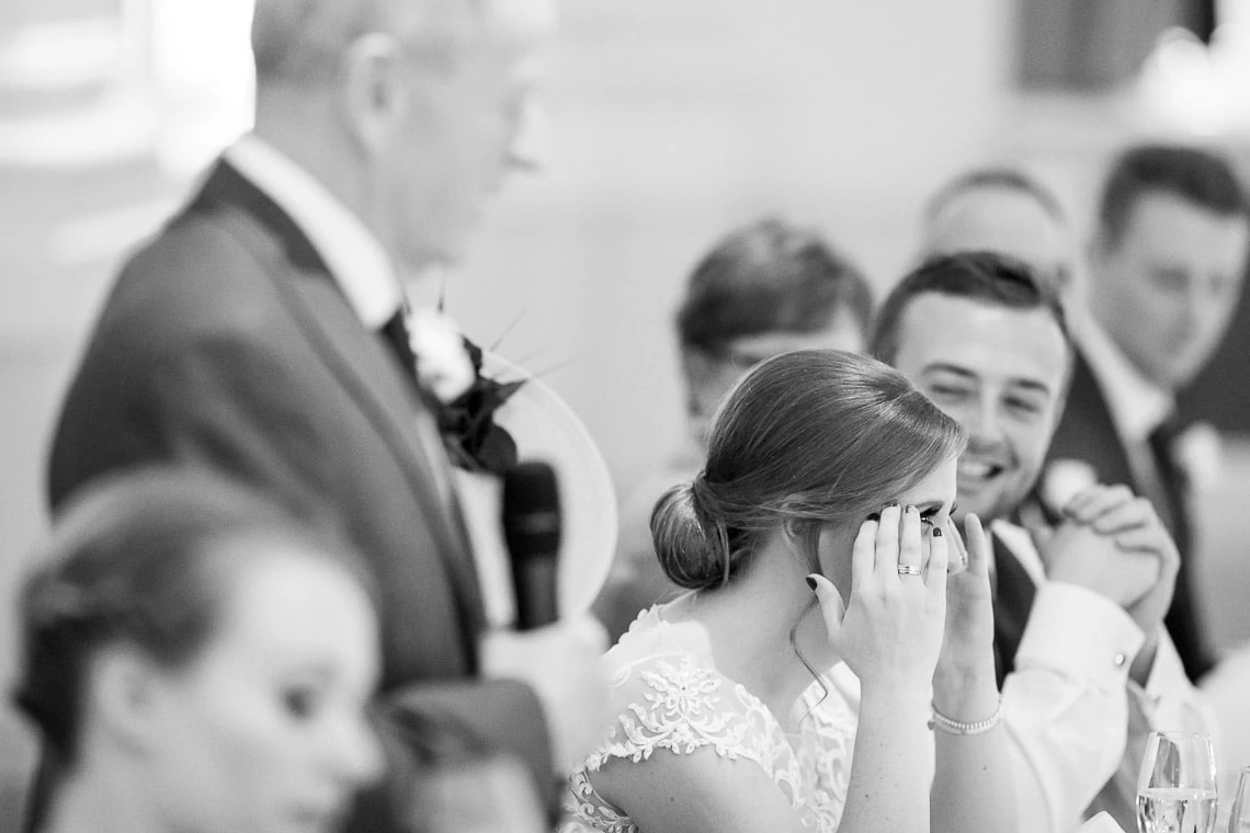 bride reacting to father of the bride speech in the King's Hall