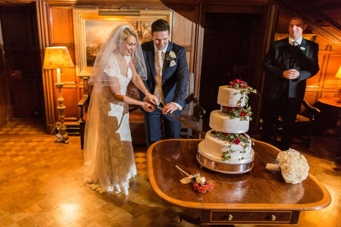 Main Hall newlyweds cut the cake