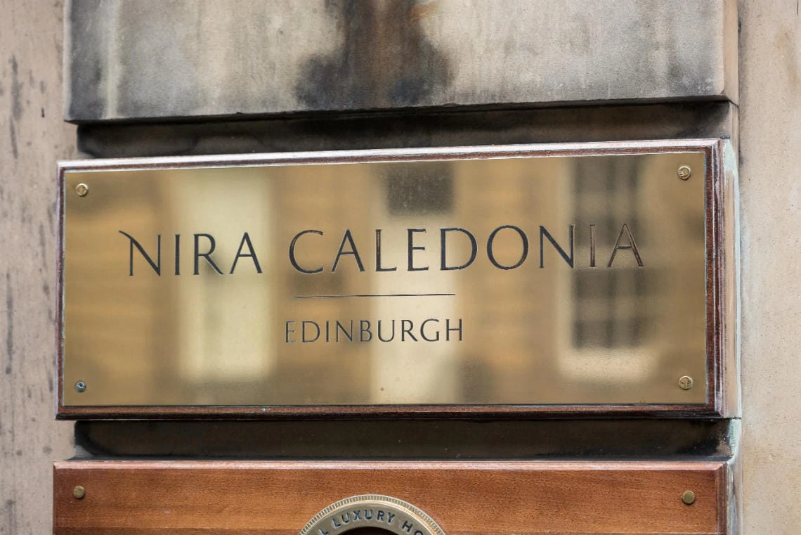 Nira Caledonia brass nameplate