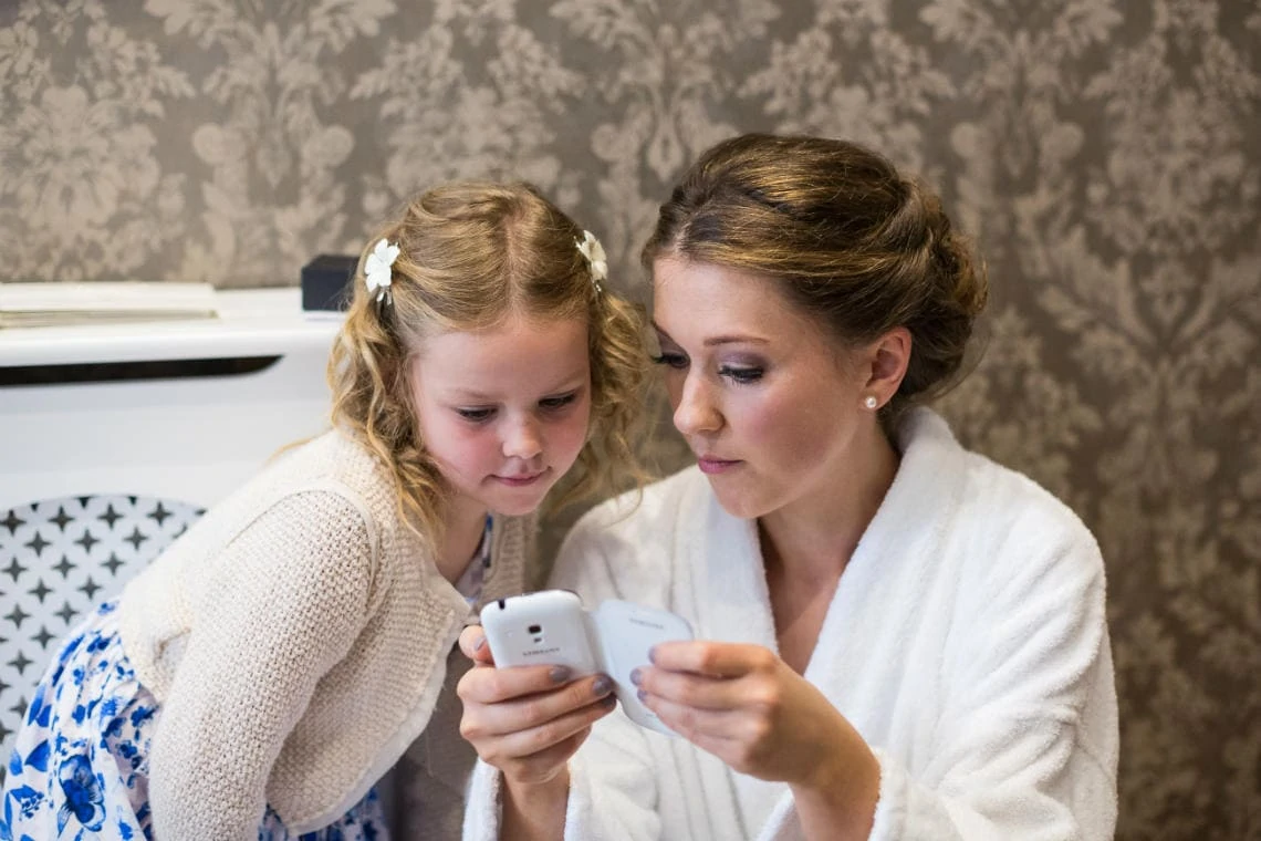 bridesmaid and flower girl in dressing gowns at Nira Caledonia Hotel