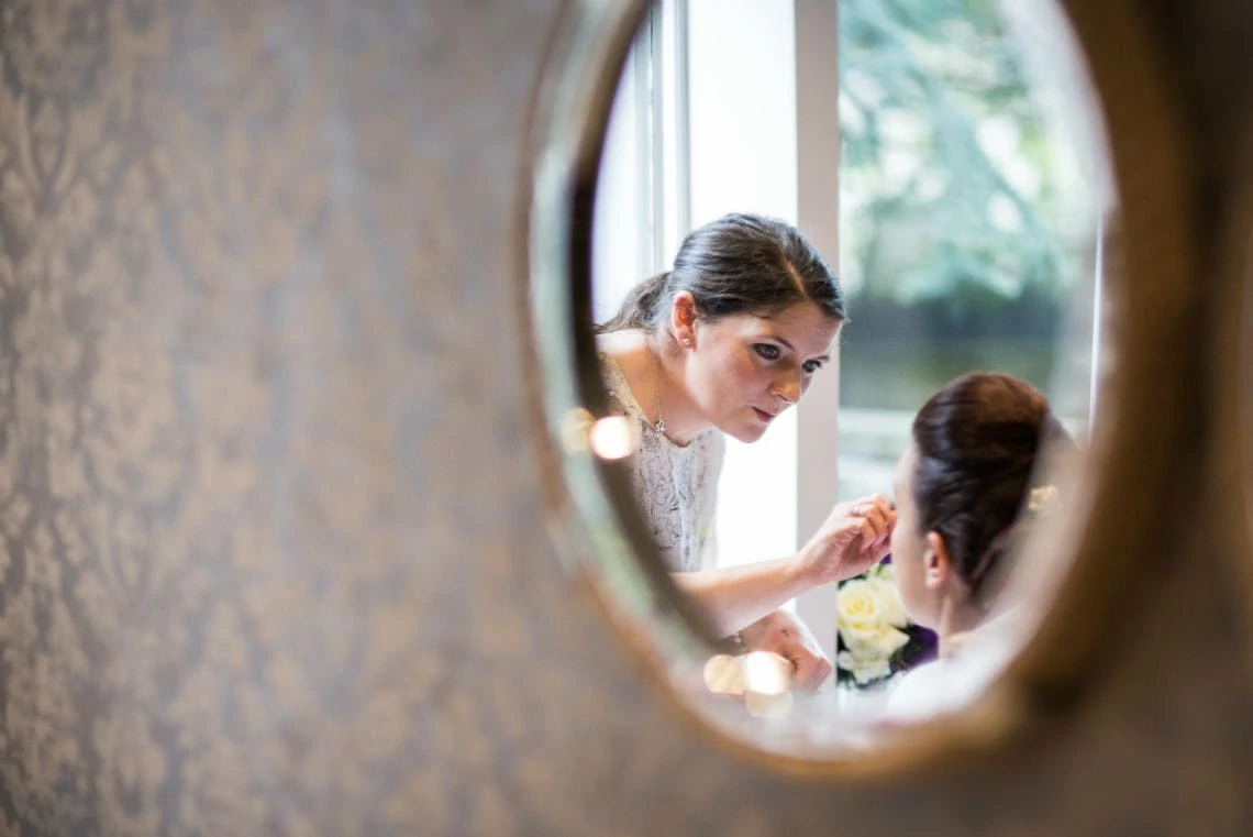 mirror reflection of bridal makeup at Nira Caledonia