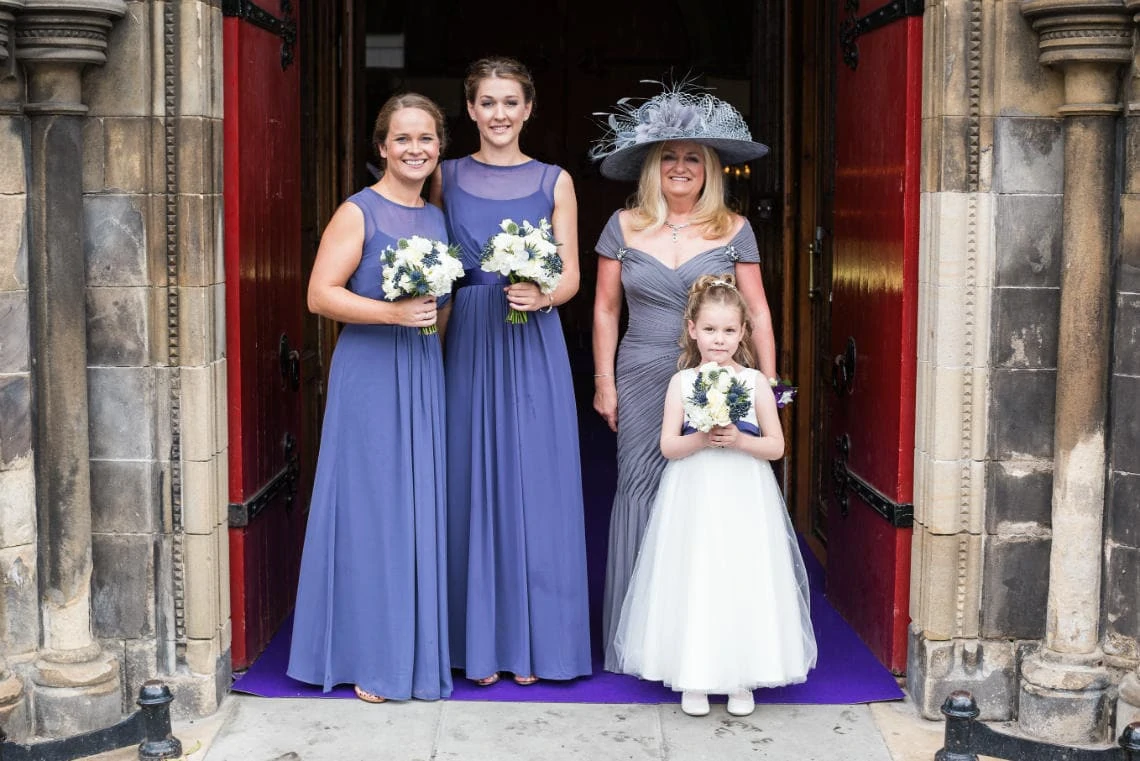 bridesmaids, flowergirl and mother of the bride at the entrance
