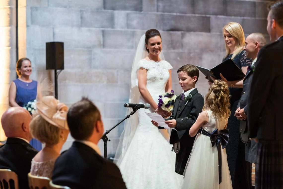 pageboy reading during the ceremony