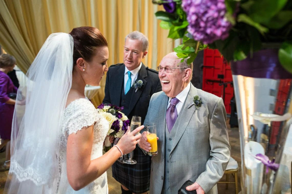 grandfather congratulates bride