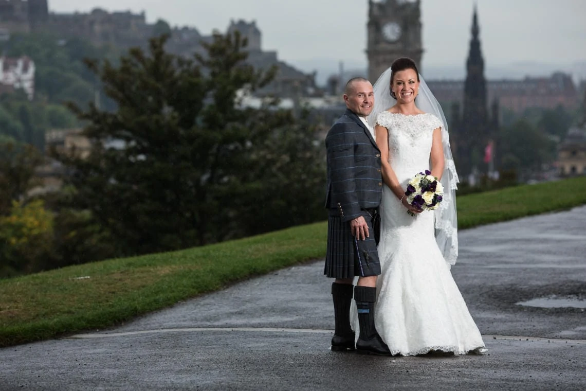 newlyweds on Calton Hill with Princes Street in the background