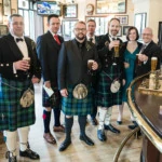 Groom and friends enjoying a pint at the Cask and Barrel pub
