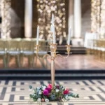 candelabra with flowers at base