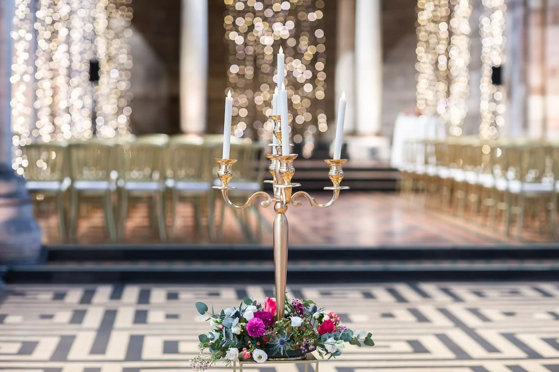 candelabra with flowers at base