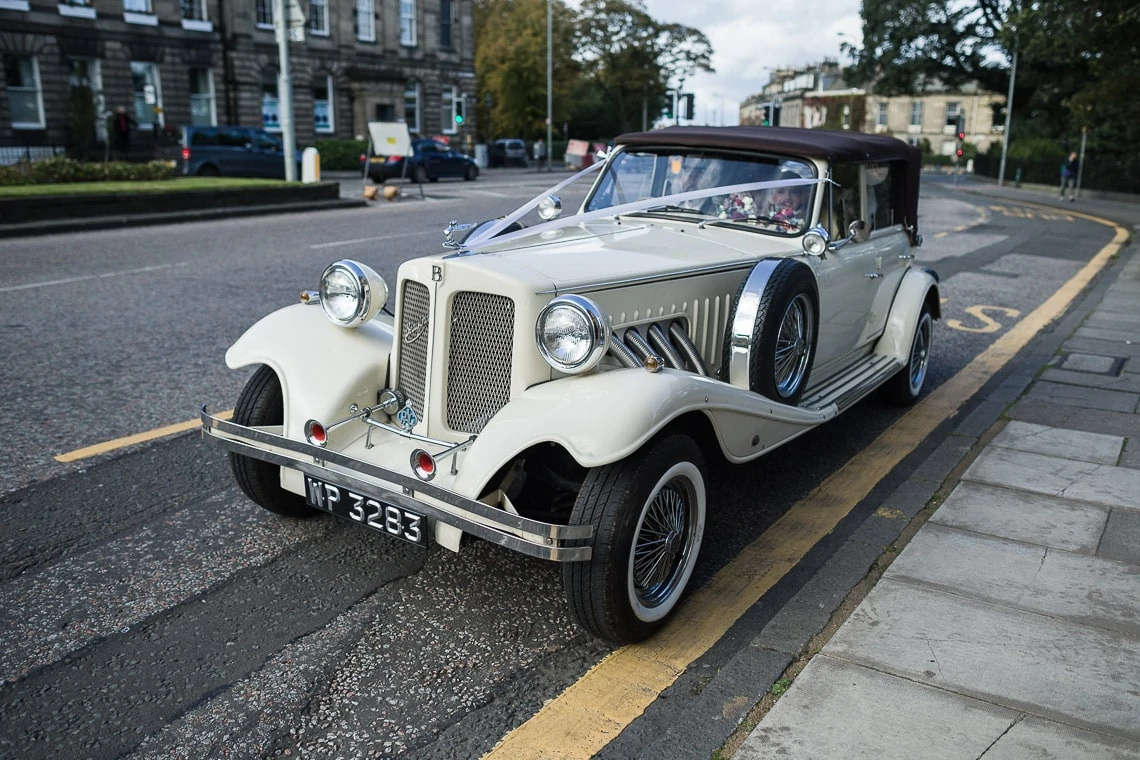 bride arrives in a Beauford car