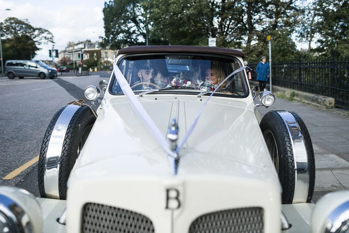 bride arrives in a Beauford car