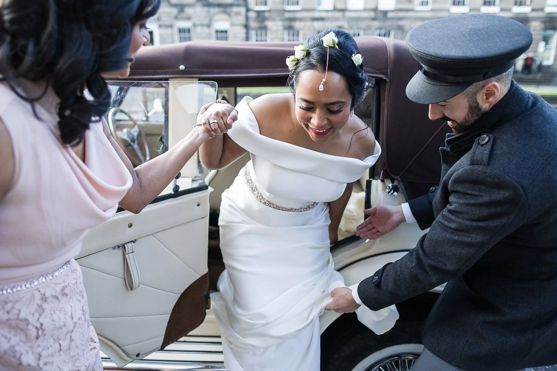 bride exits a Beauford car