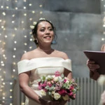 bride smiles during her marriage ceremony