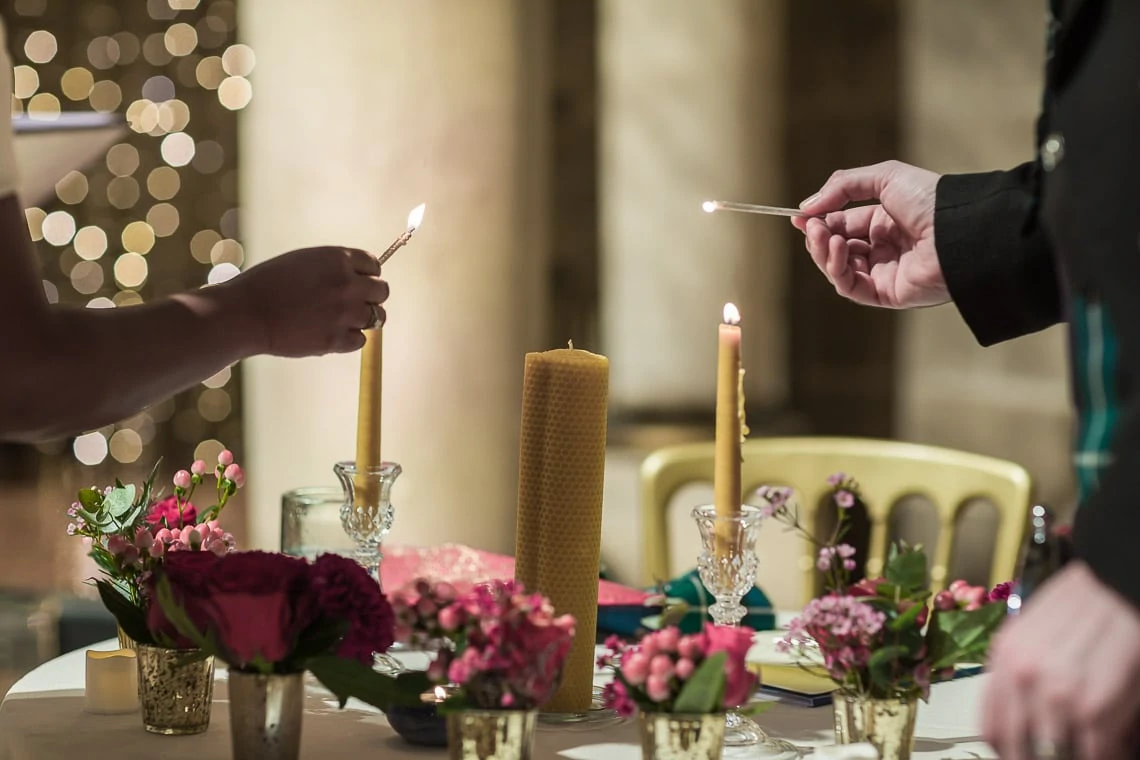 newlyweds lighting candles