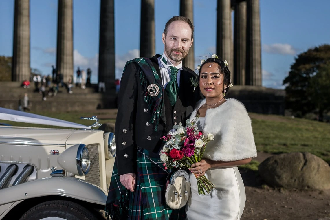 newlyweds on Calton Hill in Edinburgh