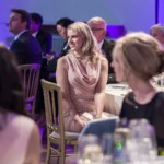 female guest listens to the speech