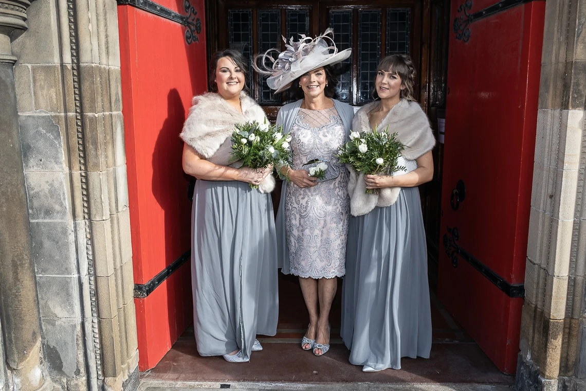 bridesmaids and mother of the bride waiting at the entrance