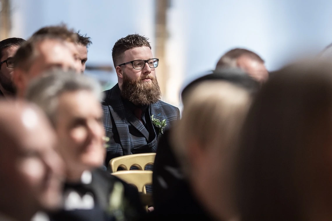 male guest watches Humanist wedding ceremony