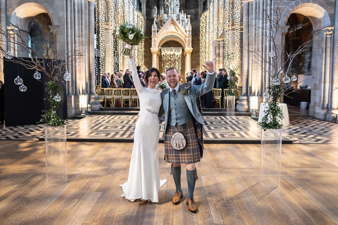 Mansfield Traquair wedding photographers - Gemma and Darren celebrate walking up the aisle