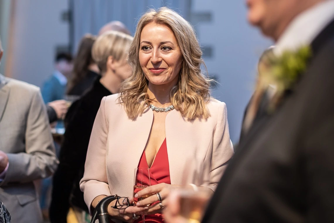 smiling female guest during the drinks reception