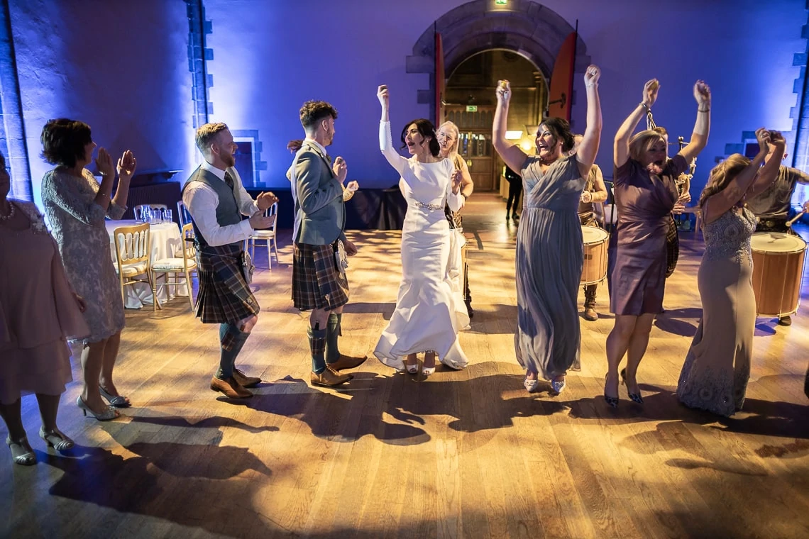 bride and guests dancing to Clanadonia
