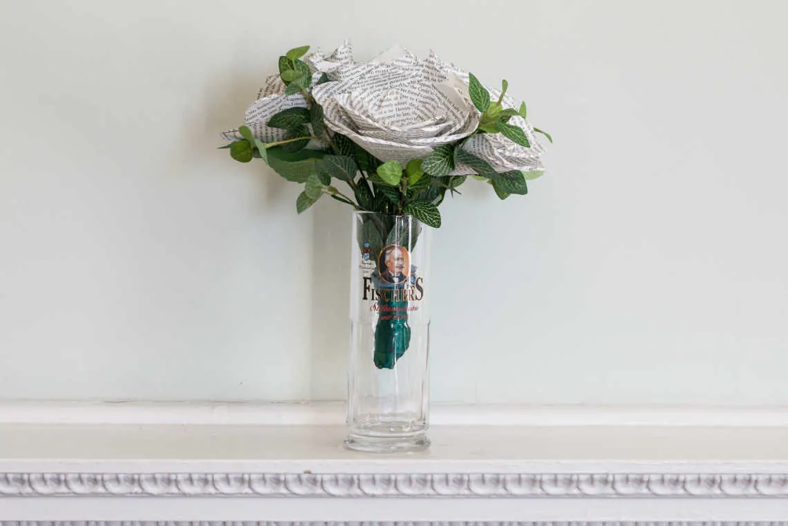 Brides book bouquet sitting in a glass