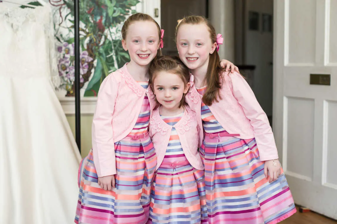 Three girls in matching outfits before marriage ceremony