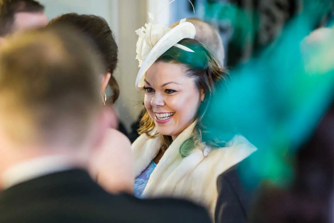 Guest wearing fascinator at drinks reception